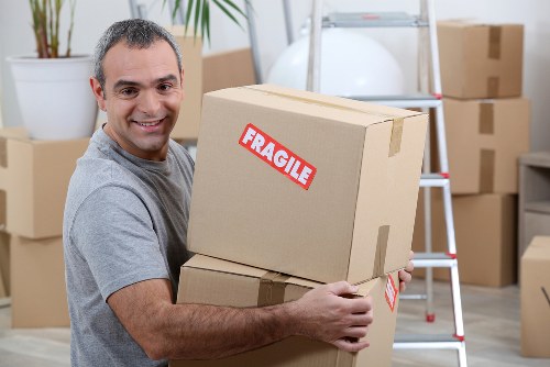 House removals in Brentford with a moving team loading boxes into a van