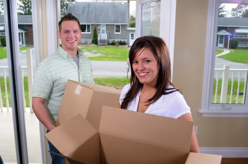 Risk-aware movers protecting floors and moving furniture safely