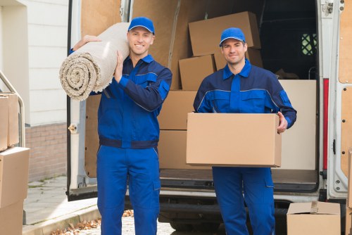 Brentford removals staff using protective gear during a move