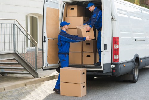 Boxes and furniture in a Brentford apartment moving job
