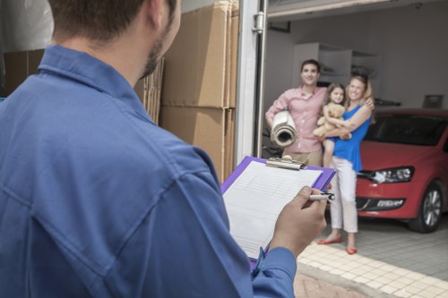 Local moving team handling boxes and furniture in Brentford