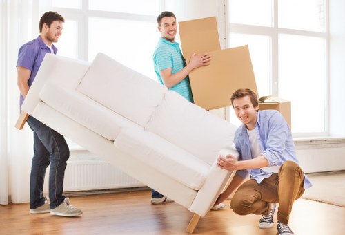 Professional movers organizing boxes during a Brentford relocation