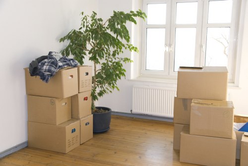 Removal vehicle and packed moving boxes ready for transport