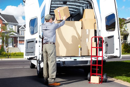 Mover handling furniture with care during a relocation