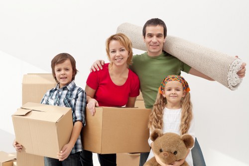 Careful packing of fragile household items by Brentford movers