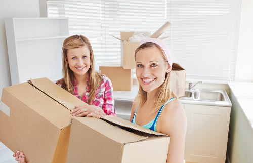 Household furniture being moved during a Brentford house removal