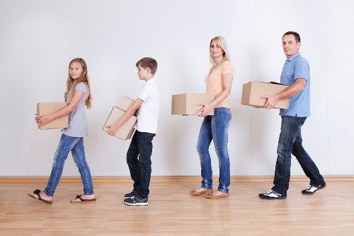 A careful moving process in a Brentford home with packed belongings